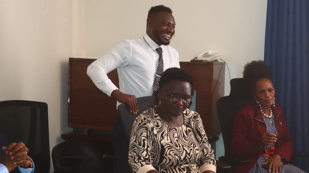 Peter Siku Karisa (Pday Hurrikane) Standing with white shirt at MCSK boardrooom as one of the directors
